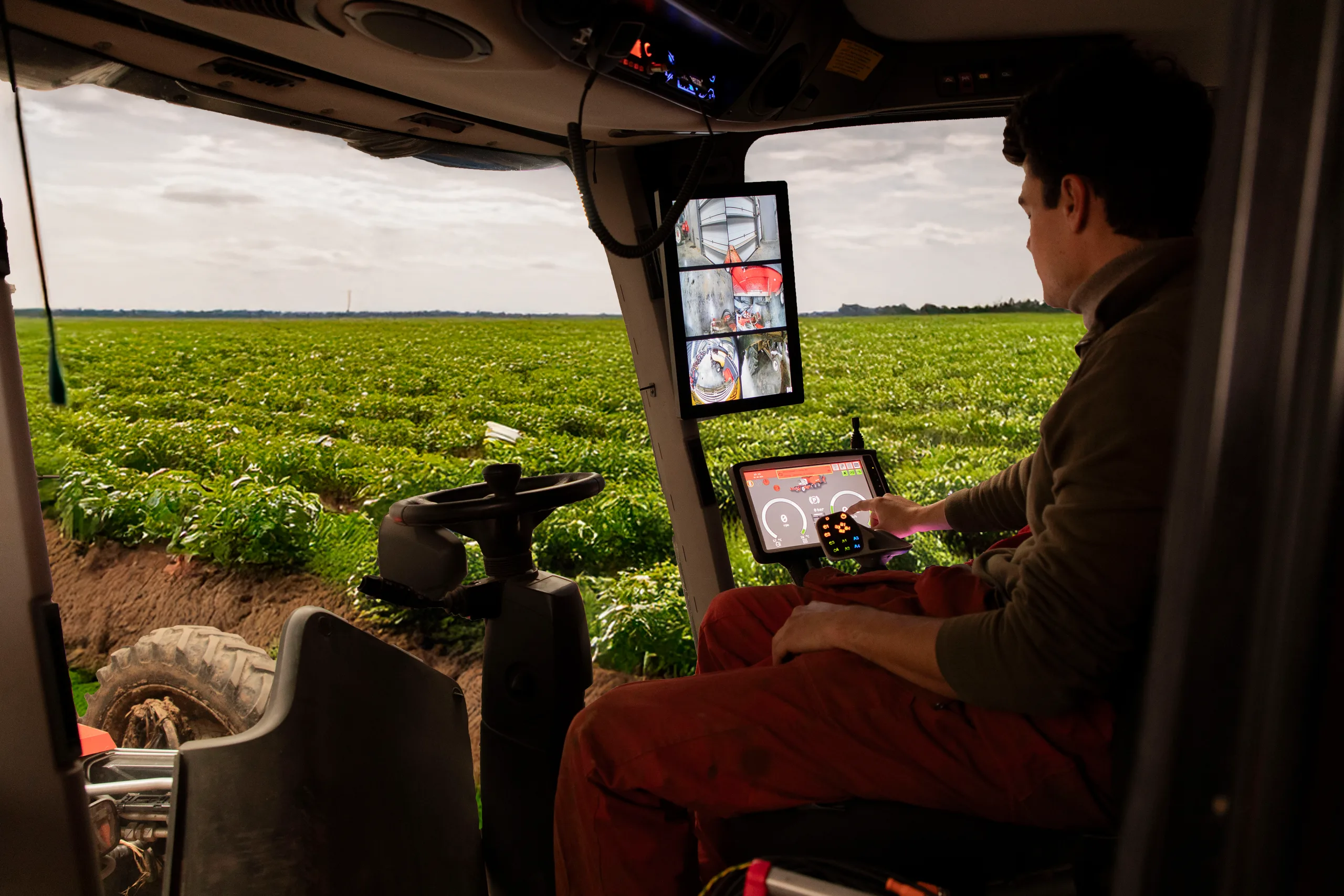 Operator in a tractor cab using a ClickTouch HMI display module